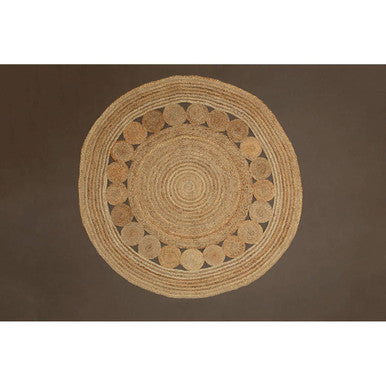 Round woven mat on a brown background