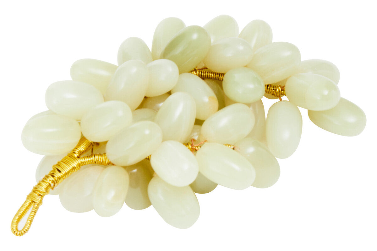 White stone bracelet with gold accents on a white background