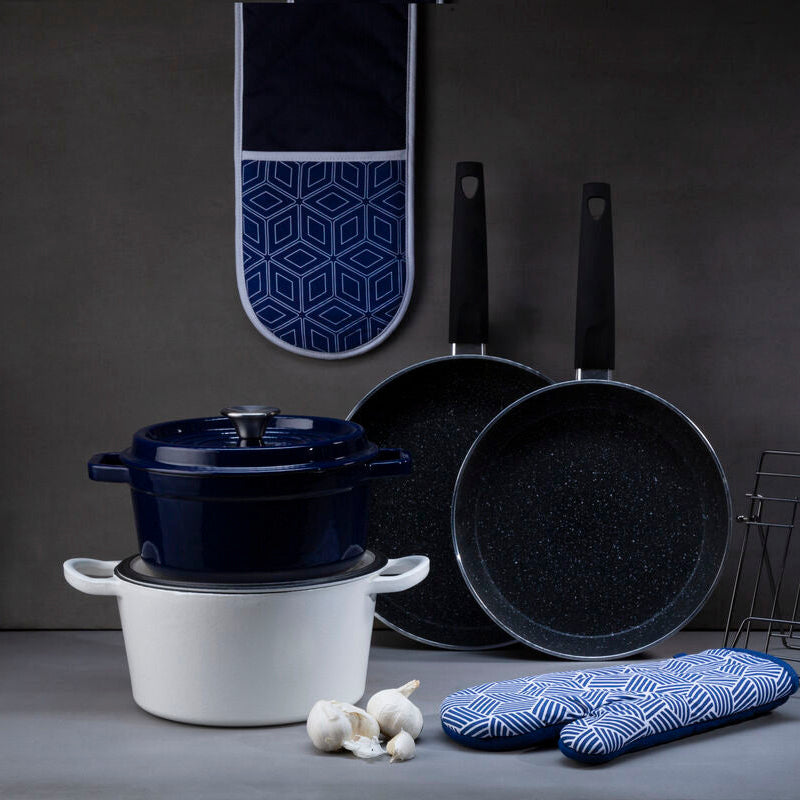 Culinary set with pots, pans, and kitchen tools on a gray background