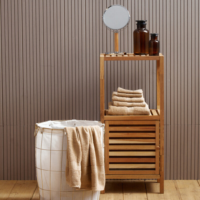 Bathroom setting with wooden shelf, laundry basket, and towels against a striped wall.