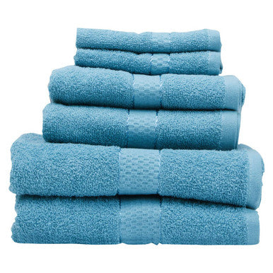 Set of blue towels stacked on a white background