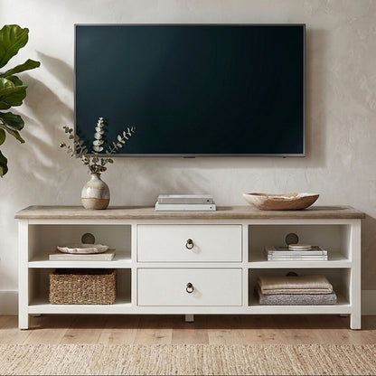 TV mounted on a wall above a wooden entertainment console with decorative items.