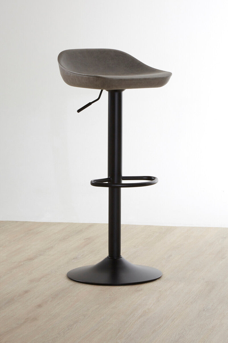 Bar stool with a wooden seat and black metal base on a light wood floor.