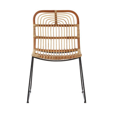 Wicker chair with black metal legs on a white background