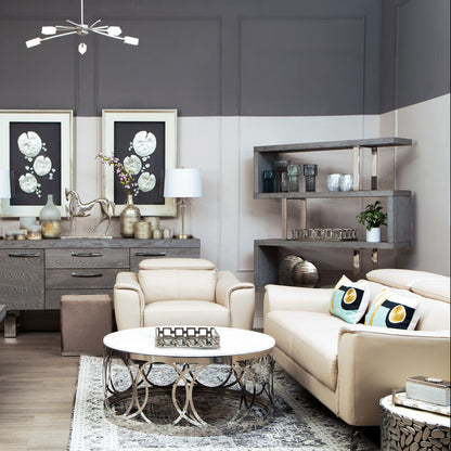 Modern living room with gray walls, white furniture, and decorative elements.