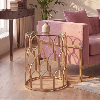 Living room with pink sofa, gold side table, and abstract wall art