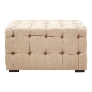 Beige tufted ottoman on a white background