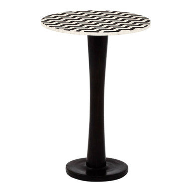 Small round table with a black and white zigzag pattern on a white background