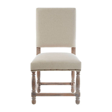 Beige upholstered chair on a white background