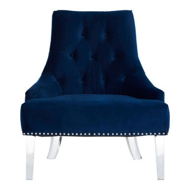 Blue velvet chair with studded details on a white background