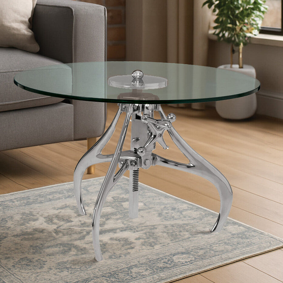 Glass coffee table with metal base in a living room setting