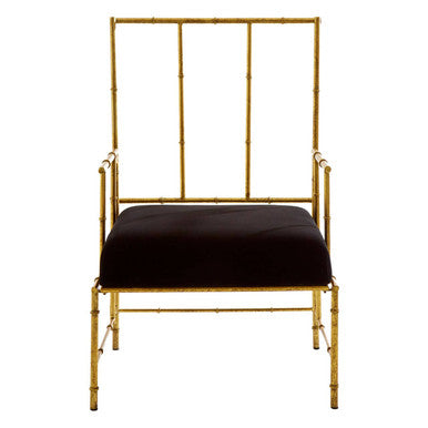Gold metal chair with black cushion on a white background