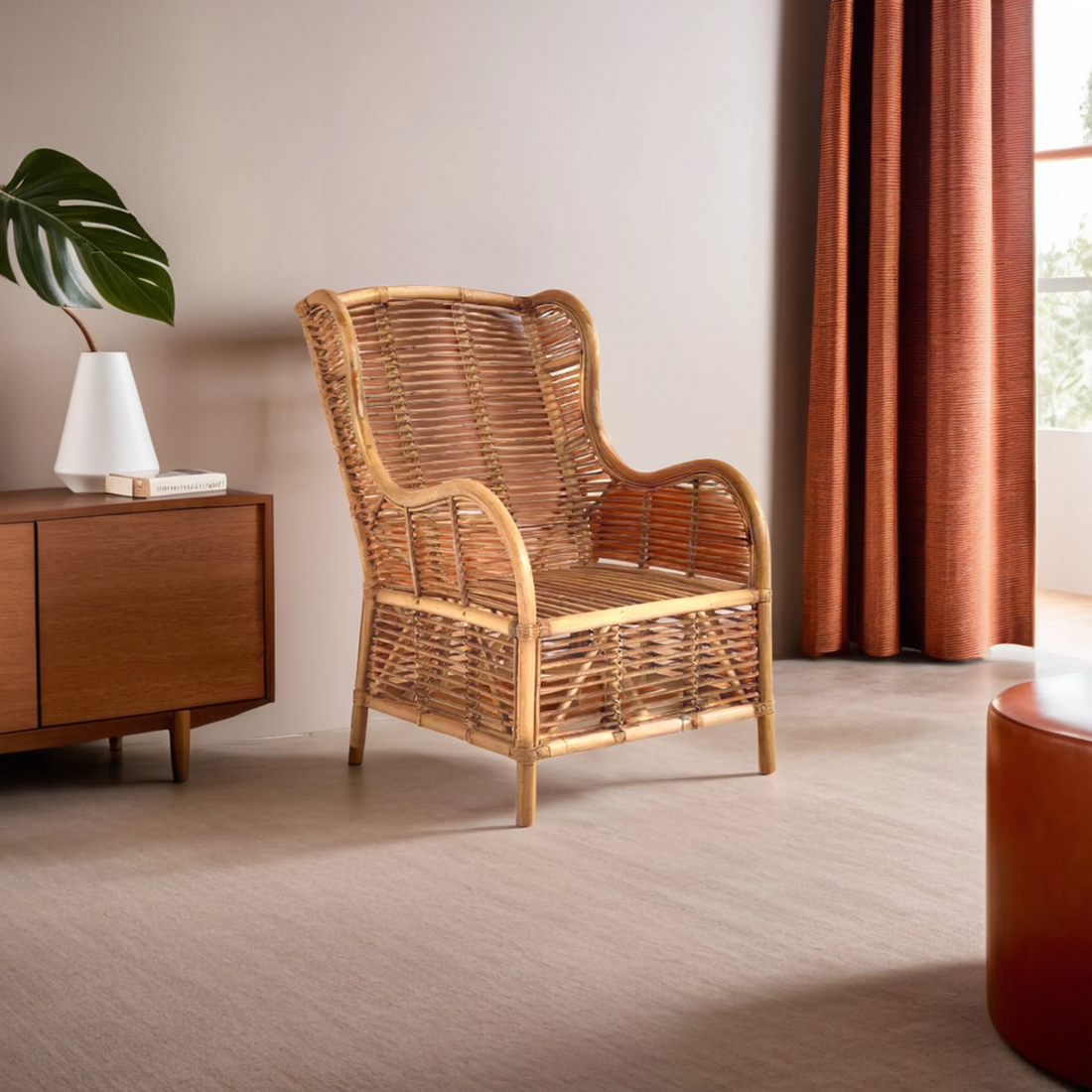 Wicker armchair in a room with a wooden side table and red curtains.