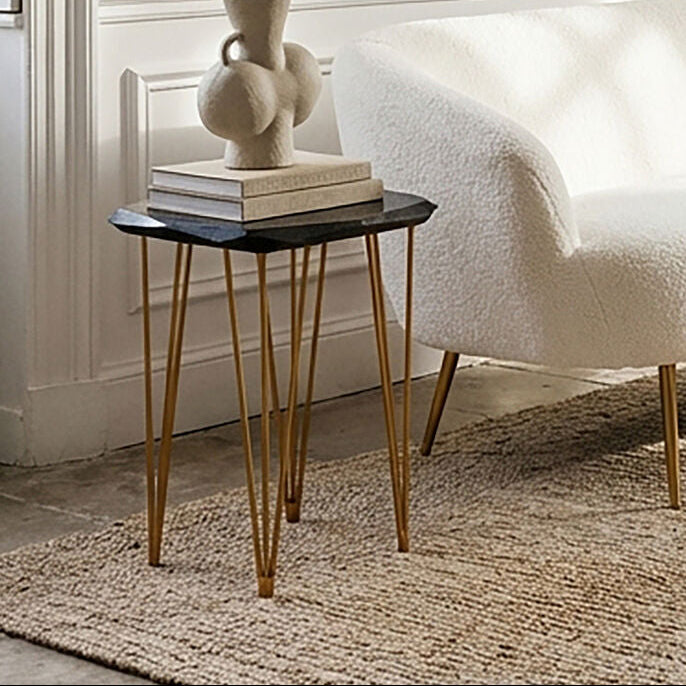 White sofa in a stylish room with a side table and decorative elements.