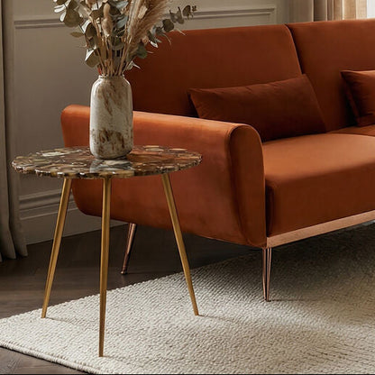 Modern living room with a brown sofa, side table, and decorative elements.
