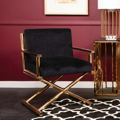 Black chair with gold frame against a red wall
