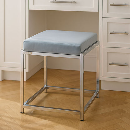 Stool with a light blue cushion on a wooden floor in a room with white cabinets.