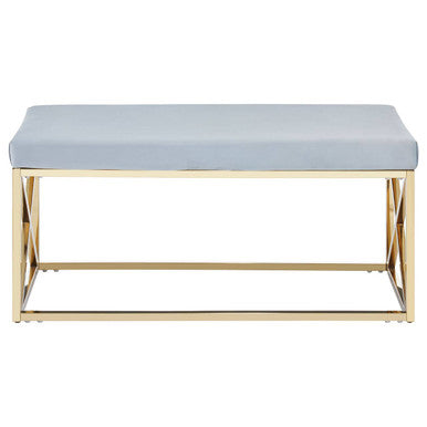 Bench with light blue cushion and gold metal frame on a white background