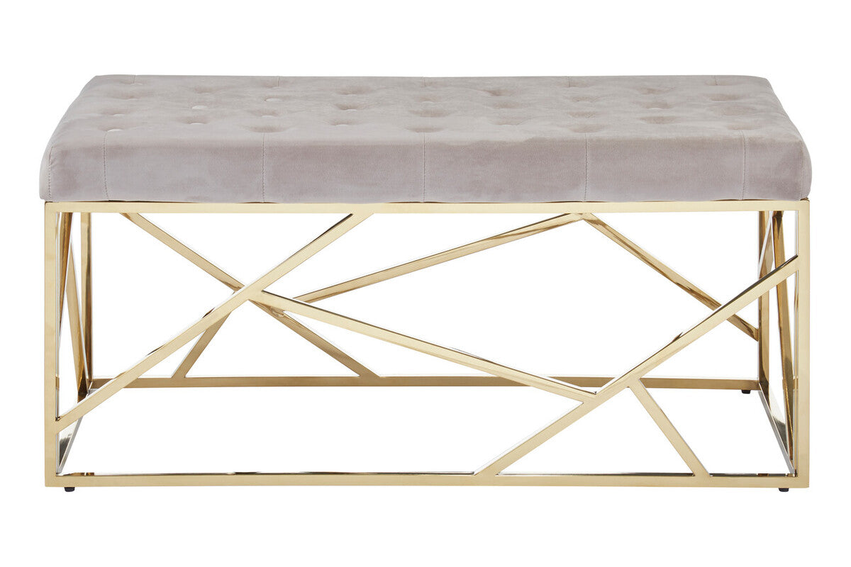 Gray tufted bench with gold geometric frame on a white background