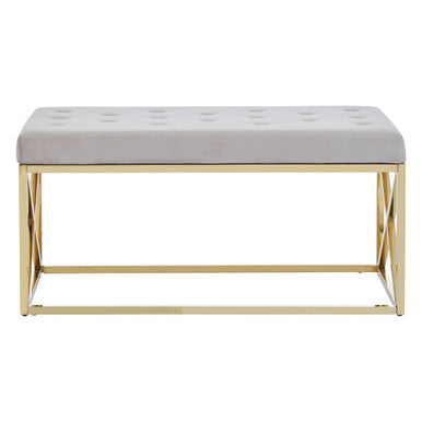 Gray tufted bench with gold metal frame on a white background