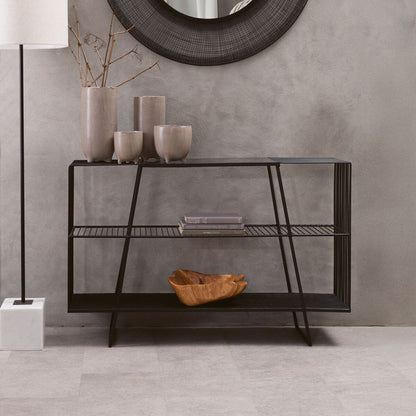 Console table with decorative items against a gray wall