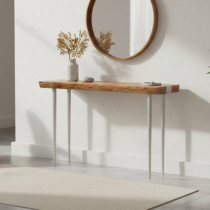 Modern interior with a wooden console table, round mirror, and decorative elements.