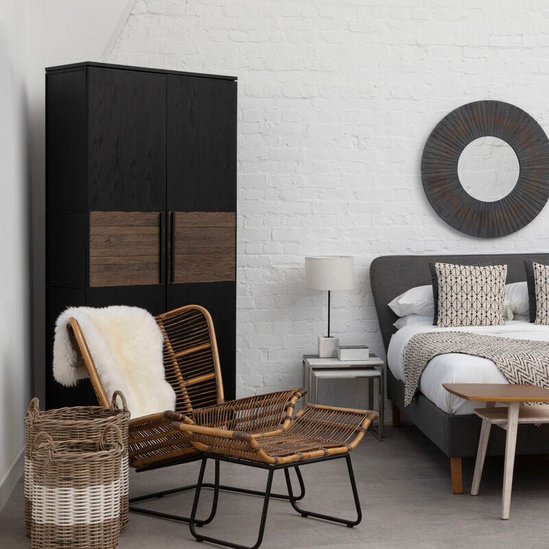 Modern bedroom with wooden bed, wardrobe, and chair.