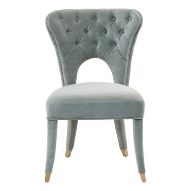 Light blue velvet chair with tufted backrest on a white background