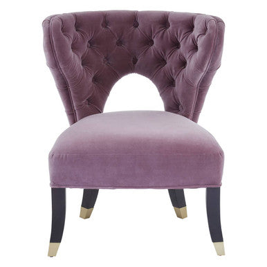 Purple velvet chair with tufted backrest on a white background