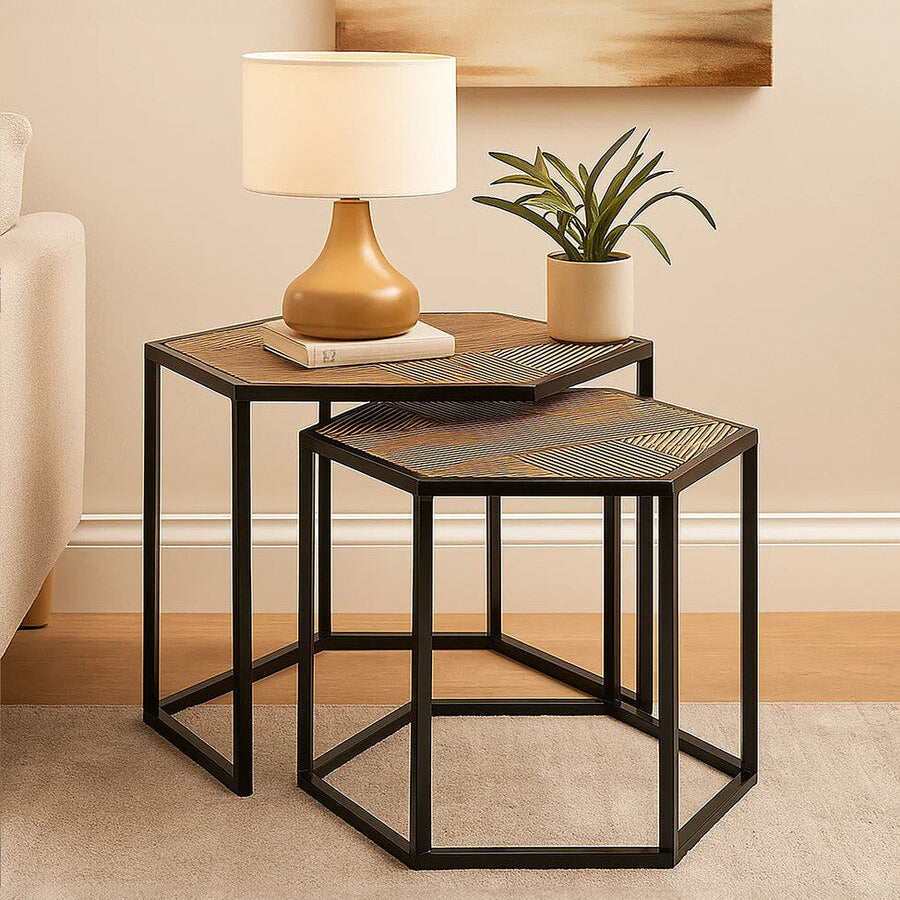 Nesting tables with a lamp and plant in a room setting