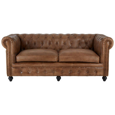 Brown leather sofa with tufted backrest on a white background