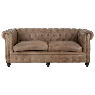 Brown leather sofa with tufted backrest on a white background