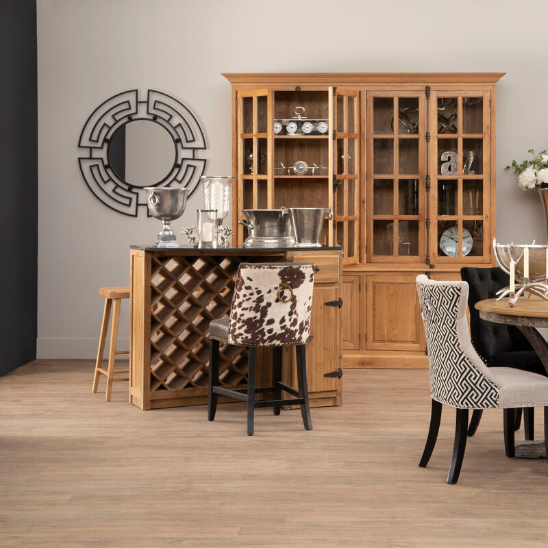 Dining room with wooden furniture, including a table and chairs, and decorative items.