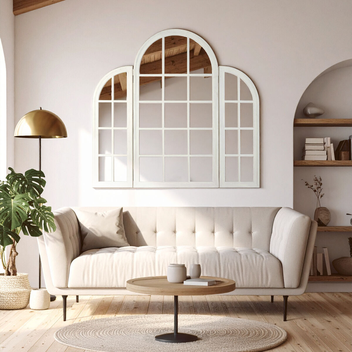 Modern living room with a large decorative mirror, white sofa, and wooden coffee table.
