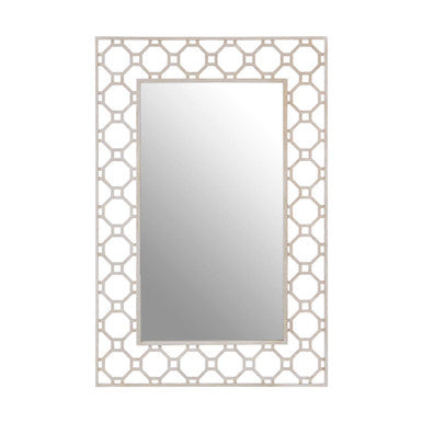 Decorative wall mirror with geometric frame on a white background