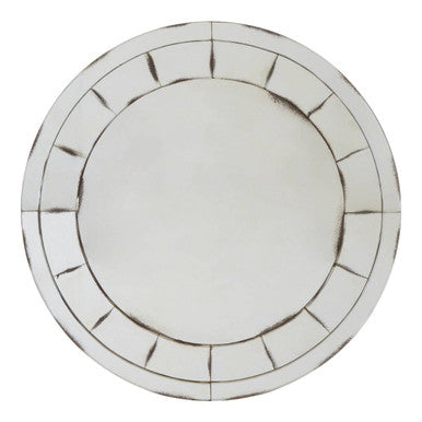 Round mirror with decorative border on a white background