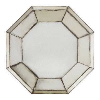 Hexagonal mirror with a beige frame on a white background