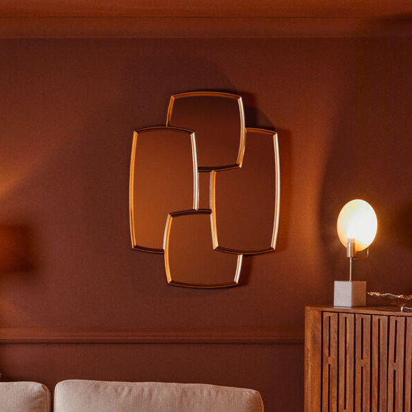 Living room with beige sofa, wooden coffee table, and decorative wall art.