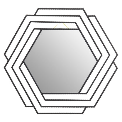 Hexagonal mirror with a geometric frame on a white background