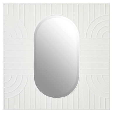 White oval mirror on a white wall with decorative patterns