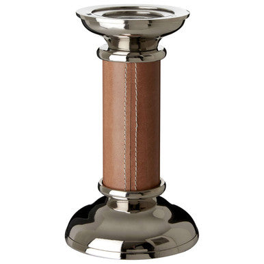 Candle holder with brown leather wrap and silver base on a white background