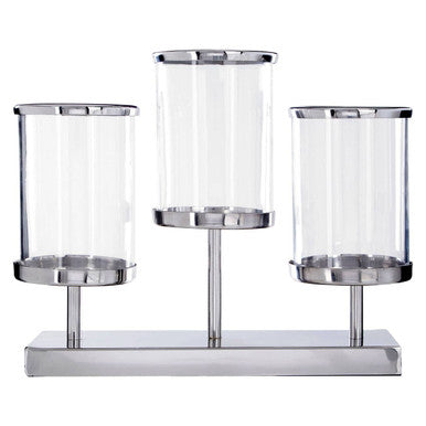 Set of three cylindrical glass holders with metal bases on a white background