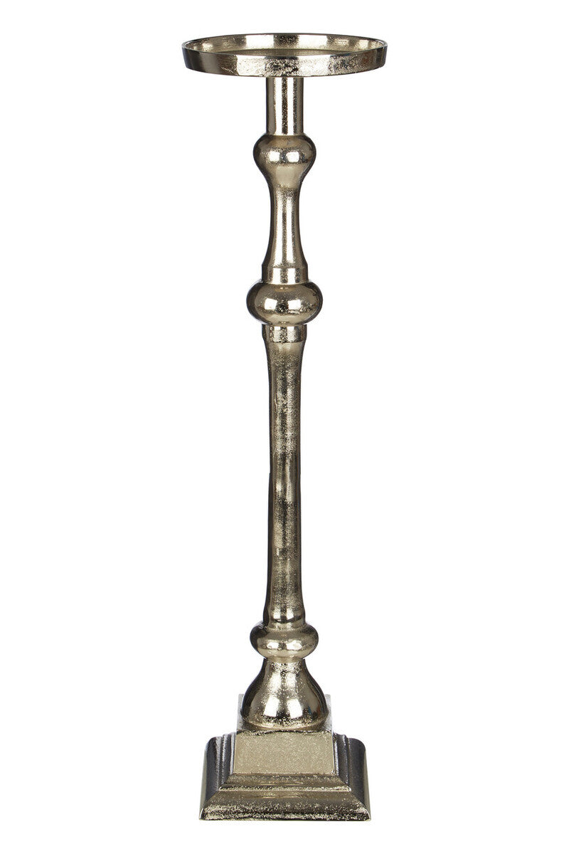 Decorative metallic candle holder on a white background