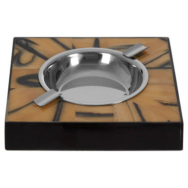 Stainless steel bowl with two spoons on a decorative black and brown square base