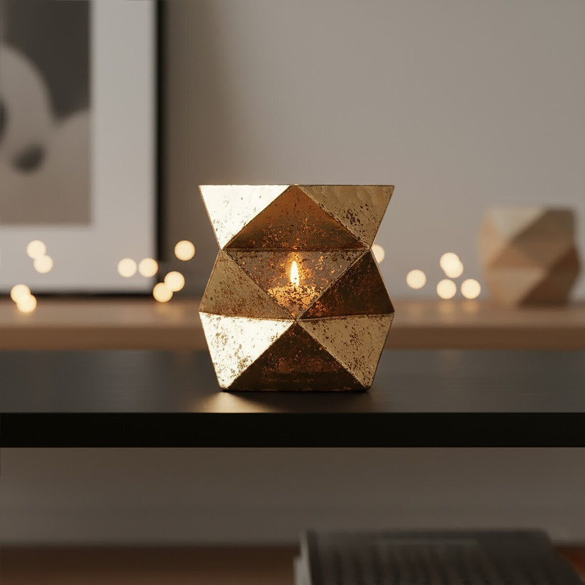 Decorative geometric candle holder on a table with blurred background