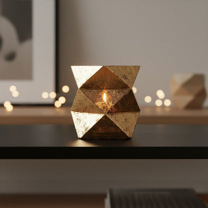 Decorative geometric candle holder on a table with blurred background
