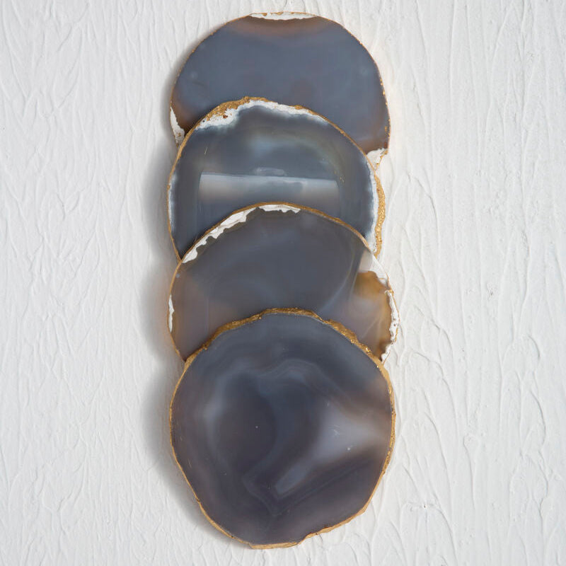 Set of four agate coasters on a white background