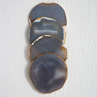 Set of four agate coasters on a white background