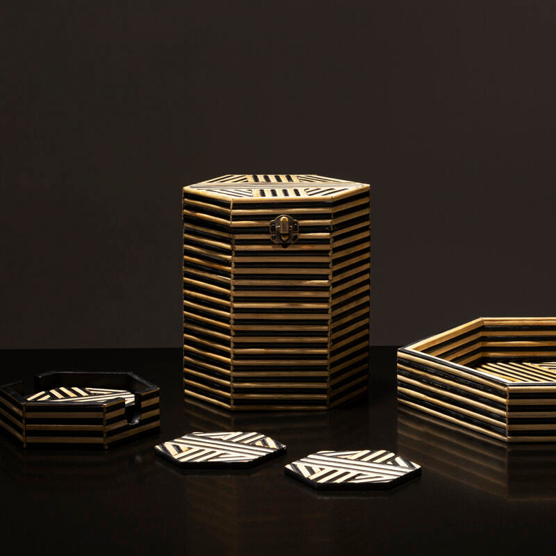 Decorative home accessories with geometric patterns on a dark background