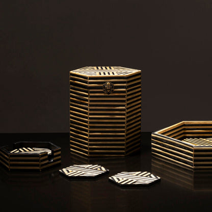 Decorative home accessories with geometric patterns on a dark background